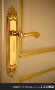Golden door handle lock, white and gold door