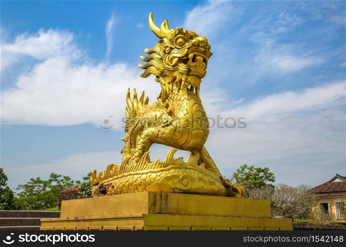Golden dragon statue located inside Imperial Royal Palace, Forbidden city in Hue, Vietnam in a summer day