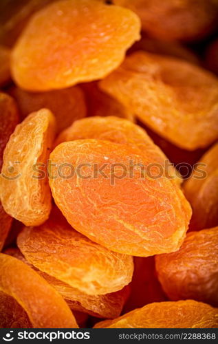 Golden dried apricots. Macro background. The texture of dried apricots. High quality photo. Golden dried apricots. Macro background.