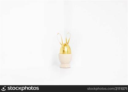 golden easter egg with bunny ears