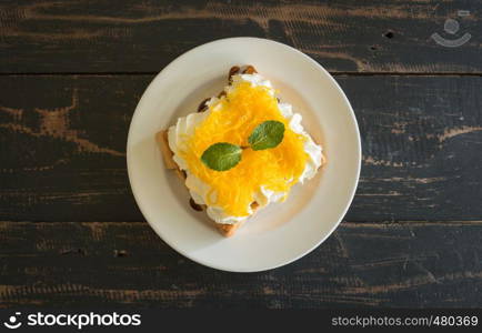 Golden Egg Yolk Threads or Foi Thong Toast and Whipped Cream and Chocolate. Thai dessert golden egg yolk threads or foi thong with peppermint on whipped cream on bread with chocolate sauce for food and drink category