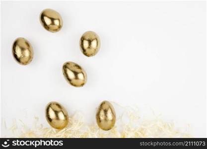 golden eggs falling straw