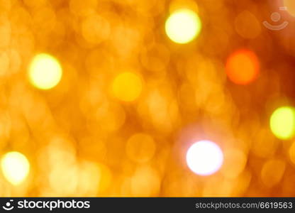 Golden flare lights blur abstract yellow background