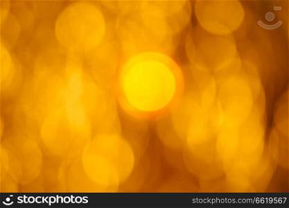 Golden flare lights blur abstract yellow background