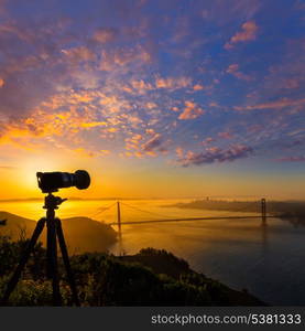 Golden Gate Bridge San Francisco sunrise California USA with photo camera silhouette