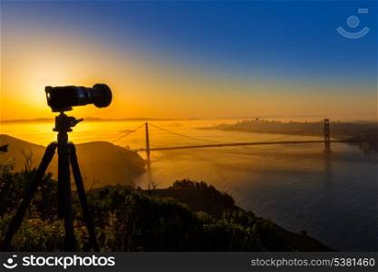 Golden Gate Bridge San Francisco sunrise California USA with photo camera silhouette