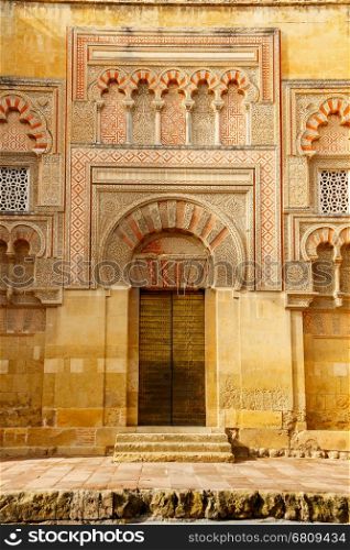 Golden Gate entrance to the La Mezquita - Catedral de Cordoba. Cordoba, Andalusia, Spain.