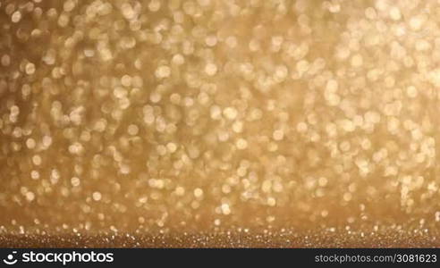 Golden glitter glowing lights christmas abstract background