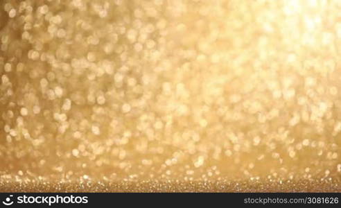 Golden glitter glowing lights christmas abstract background