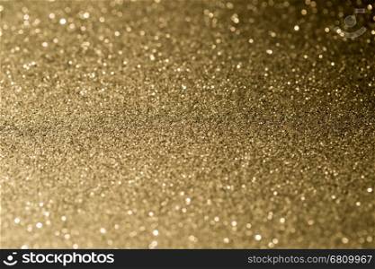 Golden glitter texture sparkle abstract background. Golden glitter texture sparkle abstract holiday background