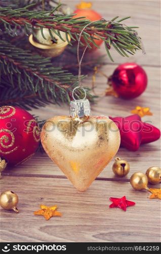 golden heart christmas decoration with fir tree, retro toned