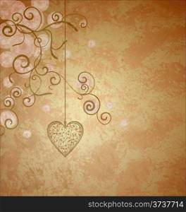 golden heart with flourishes hanging on grunge old paper background