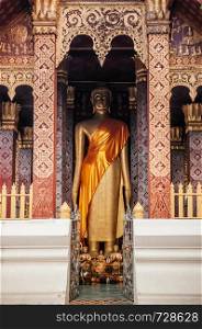 Golden historic Buddha statue with beautiful facade of Vatsensookharam temple - Luang Prabang, Laos