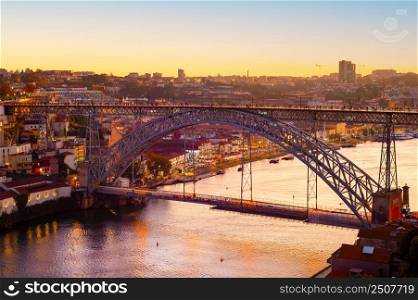Golden hour, Porto cityscape in golden sunset light, Dom Louis bridge, Douro river, Portugal