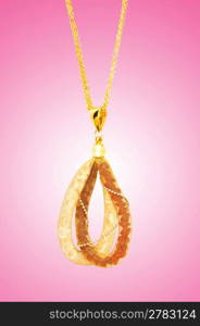 Golden jewellery against gradient background