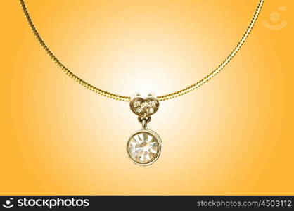 Golden jewellery against gradient background