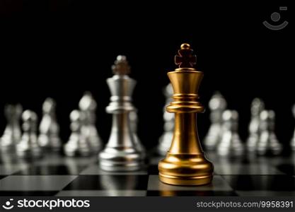 Golden King chess standing in front of other chess, Concept of a leader must have courage and challenge in the competition, leadership and business vision for a win in business games