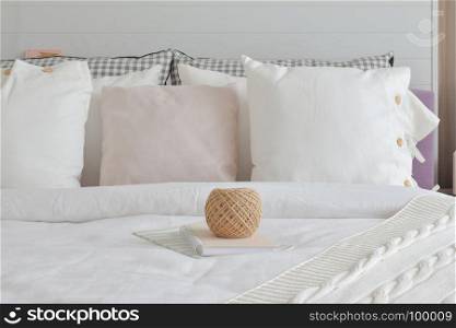 golden knitting wool and books setting on english country style bedding decoration