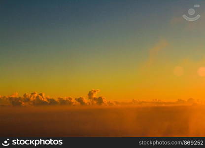 Golden light with sunrise in morning on the sky and clound .Fog cover the jungle hill in Thailand