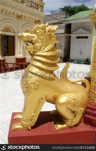 Golden lion near stupa in paya, Moniwa, Myanmar