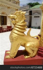 Golden lion near stupa in paya, Moniwa, Myanmar