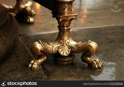 Golden ornate legs of a table