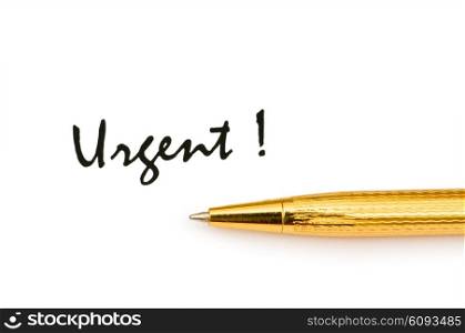 Golden pen and urgent message isolated on white