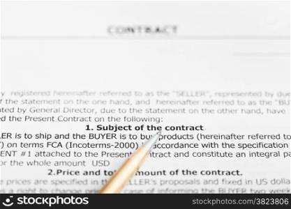 golden pen on sheet of sales contract close up