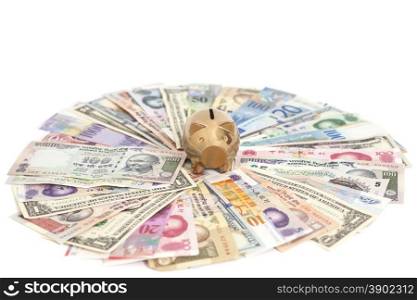 Golden piggy bank with International currencies isolated