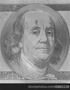 Golden portrait of U.S. president Benjamin Franklin