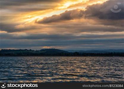 Golden powerful clouds at Lake Constance in summer sunset