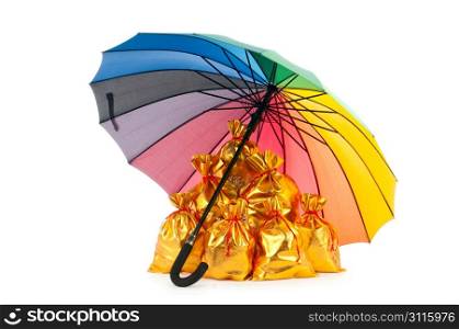 Golden sacks under protection of umbrella