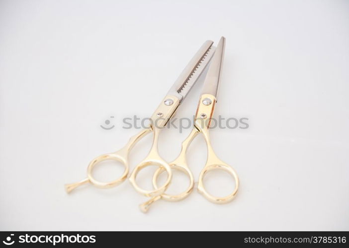 golden scissor on white background