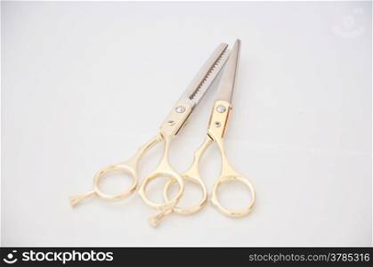 golden scissor on white background