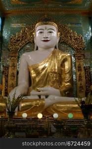 Golden sitting Buddha in temple, Sagaing Hill, Mandalay, Myanmar
