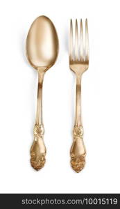 Golden spoon and fork isolated  with clipping path
