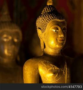 Golden statue of Buddha at Wat Phra Singh, Chiang Mai, Thailand