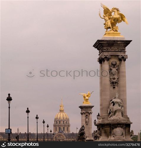 Golden statues on the Pont Alexandre III in Paris France
