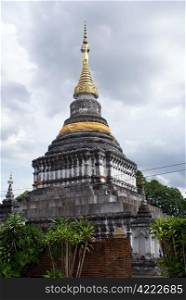 Golden stupa in at Phra Kaew Don Tao in Lampang, Thailand
