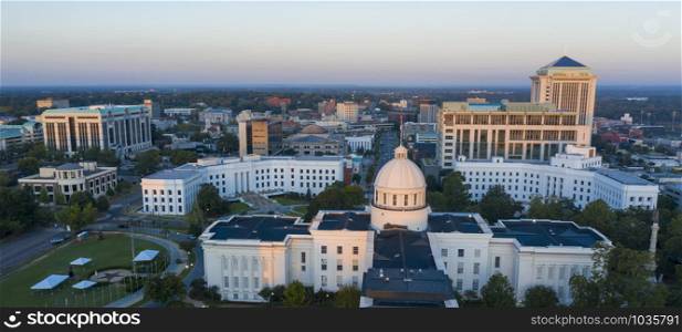 Golden sunlight reaches the horizon showing around the capital statehouse in Montgomery Alabama