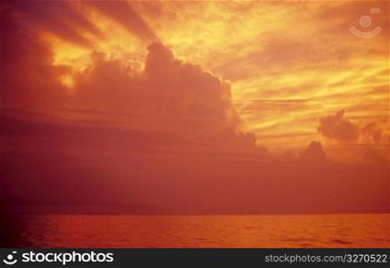 golden sunset in orange color in the sea ocean horizon