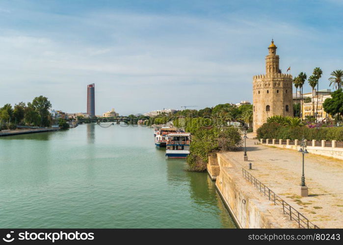 Golden tower or Torre del Oro along the Guadalquivir river, Seville, Andalusia, Spain