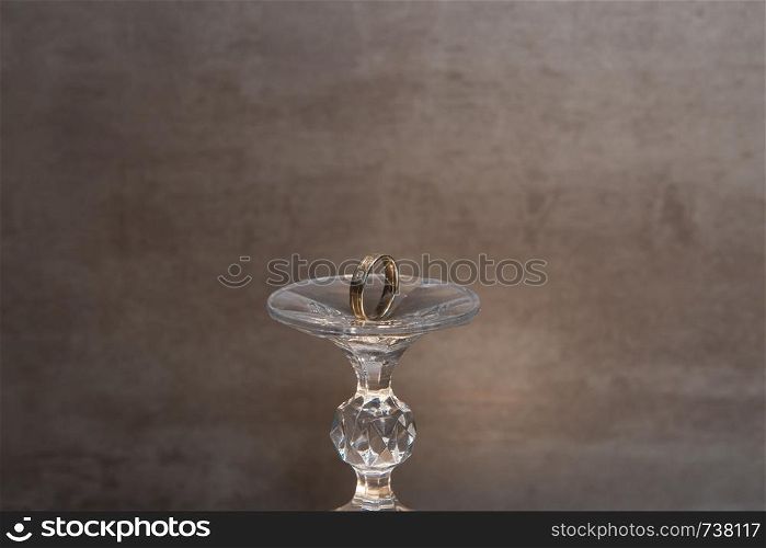 Golden wedding rings isolated on grey background. Romeo and Juliet. Golden wedding ring Romeo and Juliet