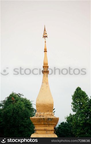 Golden with tree background at Vatsensookharam temple - Luang Prabang, Laos