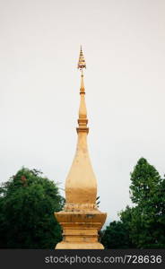 Golden with tree background at Vatsensookharam temple - Luang Prabang, Laos