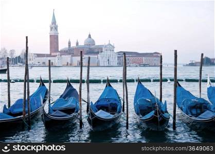 goldola boat parking in lagoo of grand canal Venice Italy