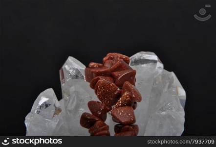Goldstone on rock crystal