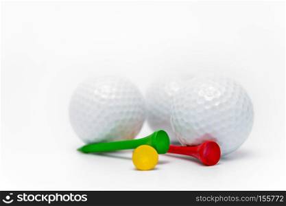 golf ball and tees on white background