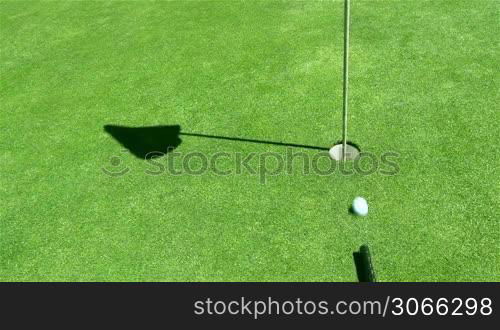 golf ball is shot in the hole with a kind of a biilard hit, creative, innovation, different