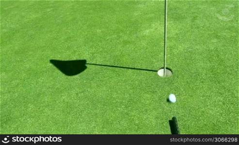 golf ball is shot in the hole with a kind of a biilard hit, creative, innovation, different